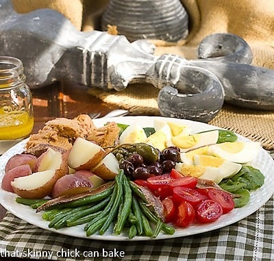 Classic French Salade Niçoise side view on a white plate.