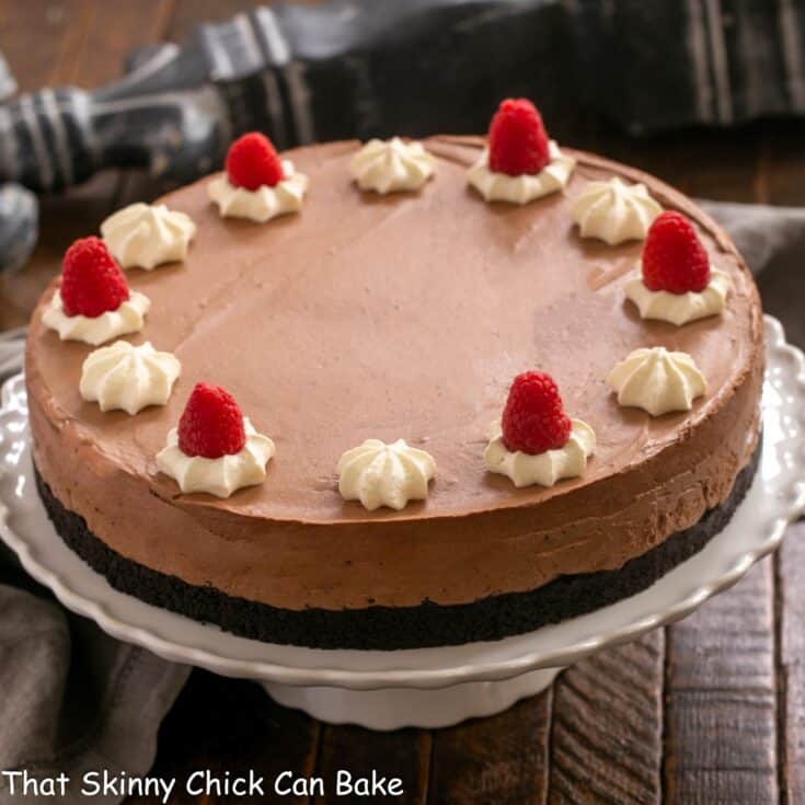 Chocolate Mousse Cake on a white cake stand.