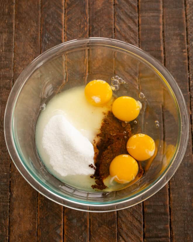 Eggs. sugar and instant coffee in a mixing bowl.