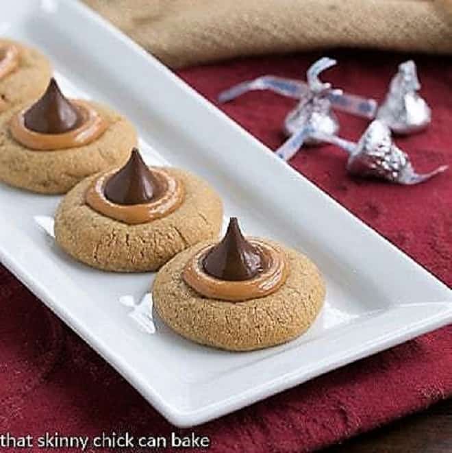 Caramel Biscoff Blossoms Cookies on a white ceramic tray.