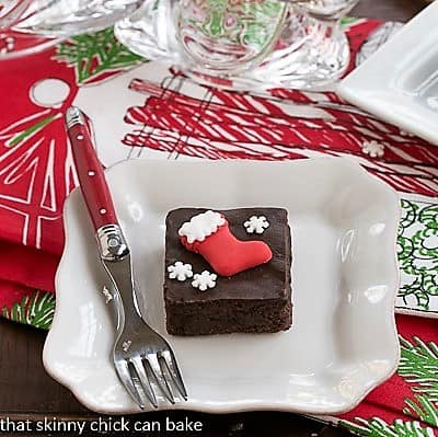 Plated Fudgy red wine brownies with holiday garnishes