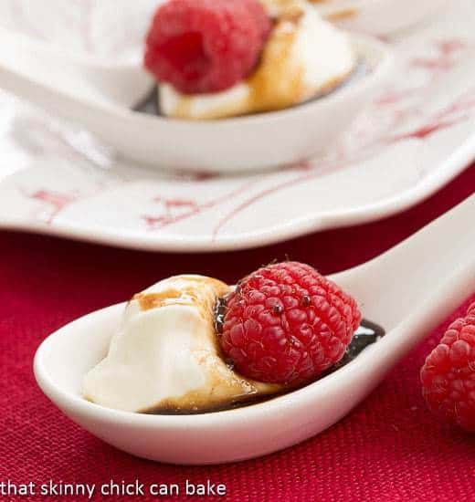 Balsamic Raspberries with Mascarpone Cream in white soup spoons