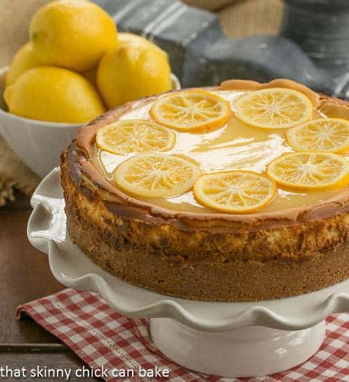 Lemon Bar Cheesecake on a white cake stand