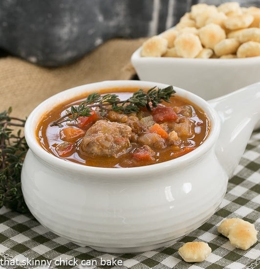 Sausage, Lentil and Vegetable Chowder in a white soup bowl