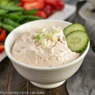 Sun-dried tomato dip garnished with cucumbers