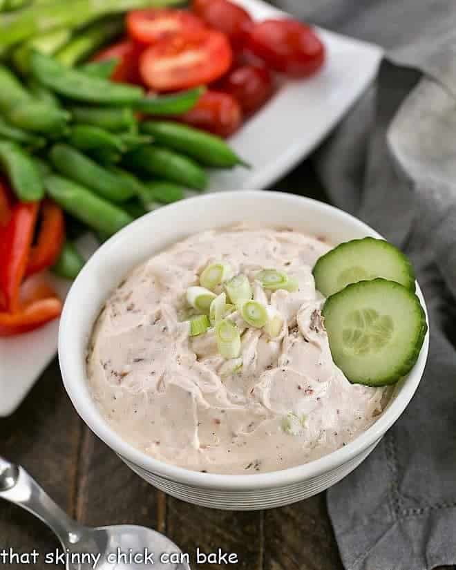 Sun-dried tomato dip in a white bowl