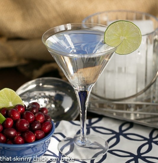 White Cosmopolitans garnished with a slice of lime.