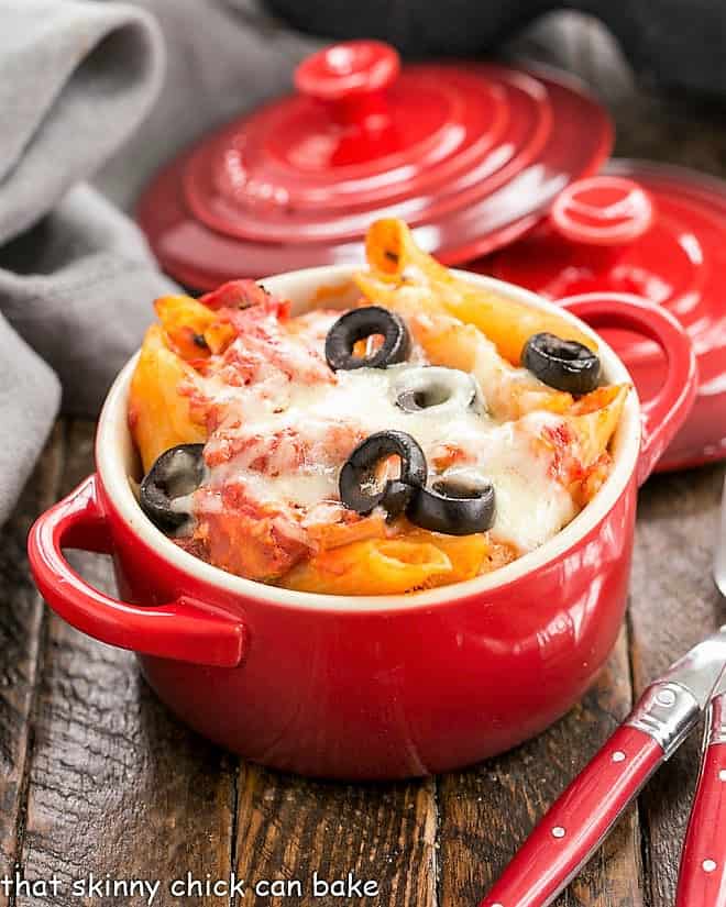 Cheesy Pasta Bake in red crocks.