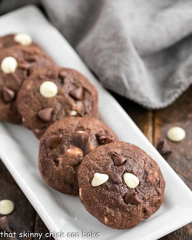 White tray filled with brownie cookies.