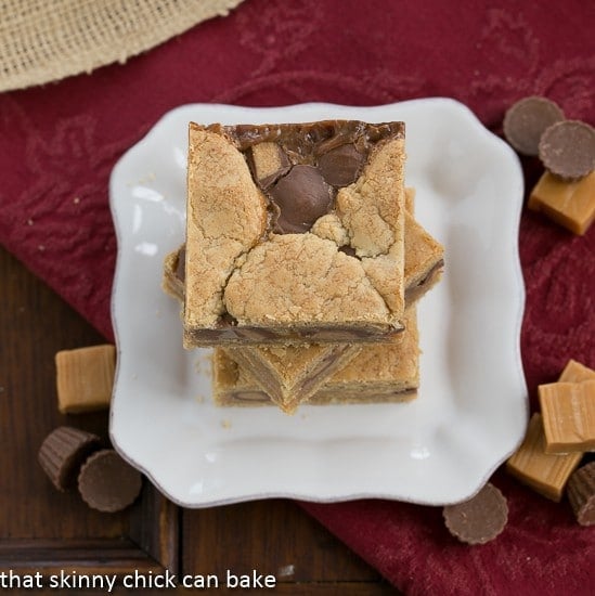 Chocolate Peanut Butter Bars stacked on a white plate