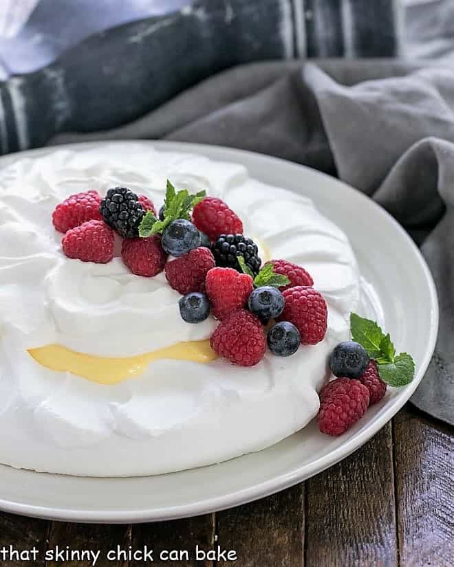 Lemon Pavlova on a white serving plate
