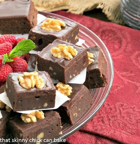 Chocolate Glazed Walnut Brownies  on a glass tray.