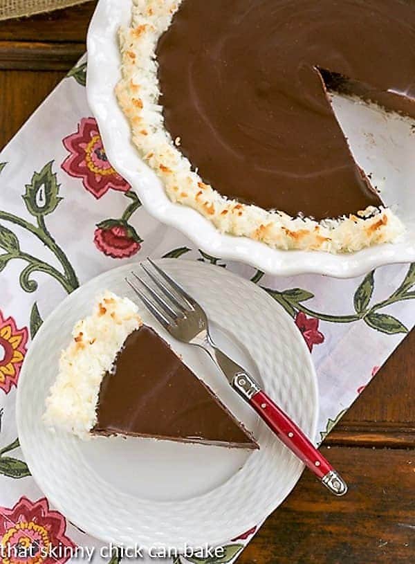 Coconut Crusted Chocolate Ganache Pie with a slice removed
