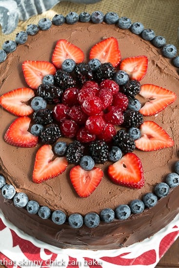 Layered chocolate mousse cake with a slice removed.