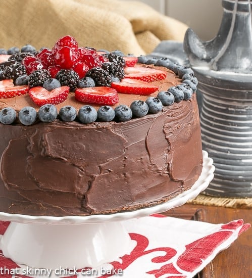 Layered Chocolate Mousse Cake on a cake stand.