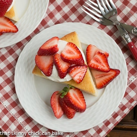 Overhead view of a slice of French Visitidine cake on a white plate