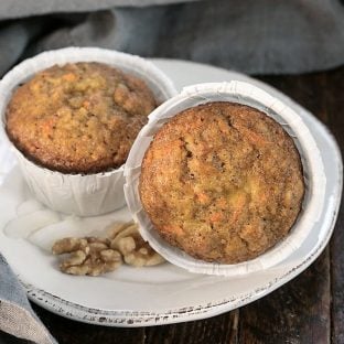 2 Cream Cheese Filled Carrot Cake Muffin on a round white plate