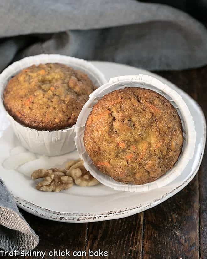 2 Cream Cheese Filled Carrot Cake Muffin on a round white plate