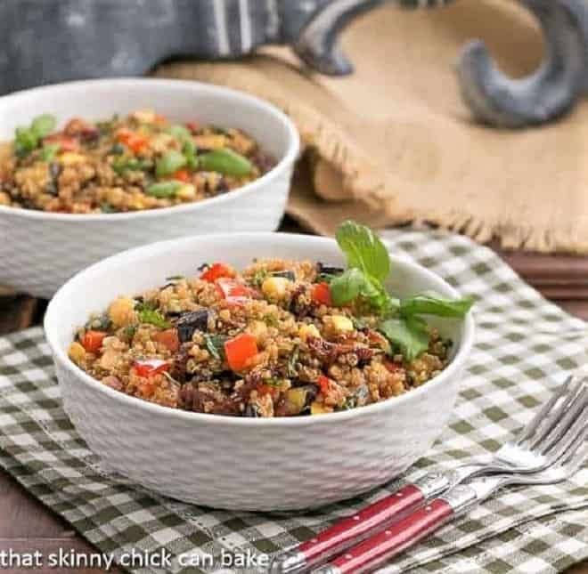Two bowls of quinoa salad on a checked napkin