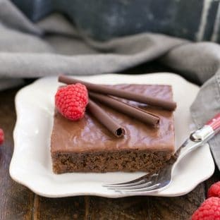 Chocolate Syrup Brownies on a square white plate with a fork