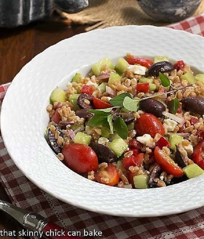 Greek Farro Salad from in a white basketweave bowl.