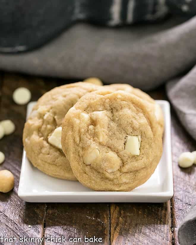 White Chocolate Macadamia Nut Cookies on a square white plate.