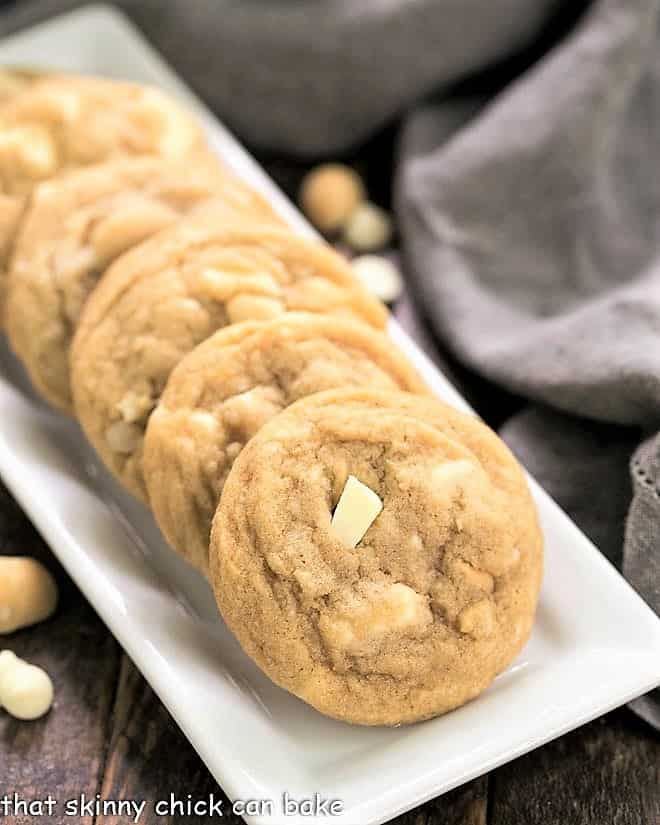  White Chocolate Macadamia Nut Cookies on a white ceramic tray.