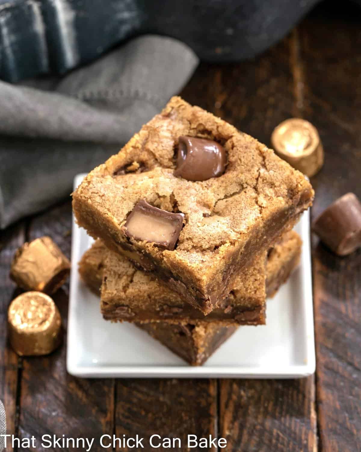 Stack of 3 Biscoff Rolo Bars on a small square white plate