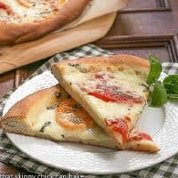 Two slices of pizza made with homemade pizza dough