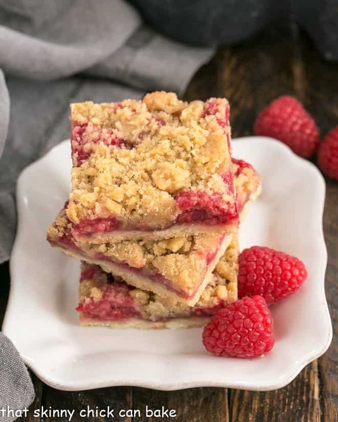 Streusel Topped Raspberry Squares on a small square white plate