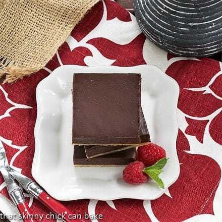 Overhead view of a stack of Truffle Brownies on a white square plate.