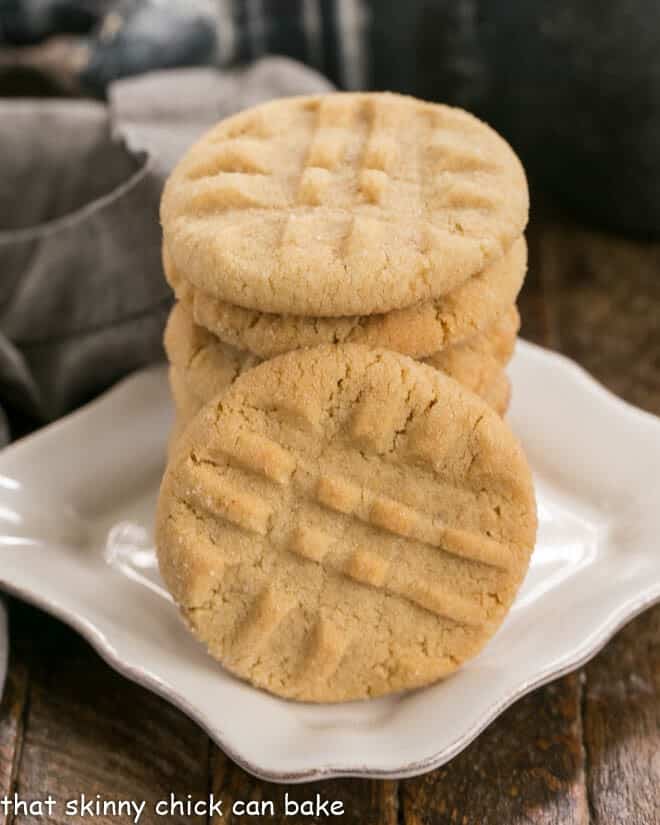 Best Peanut Butter Cookies - An exquisite easy peanut butter cookie recipe with the perfect snap and a bit of texture from extra chunky peanut butter! The Best Peanut Butter Cookies on a square white dessert plate.