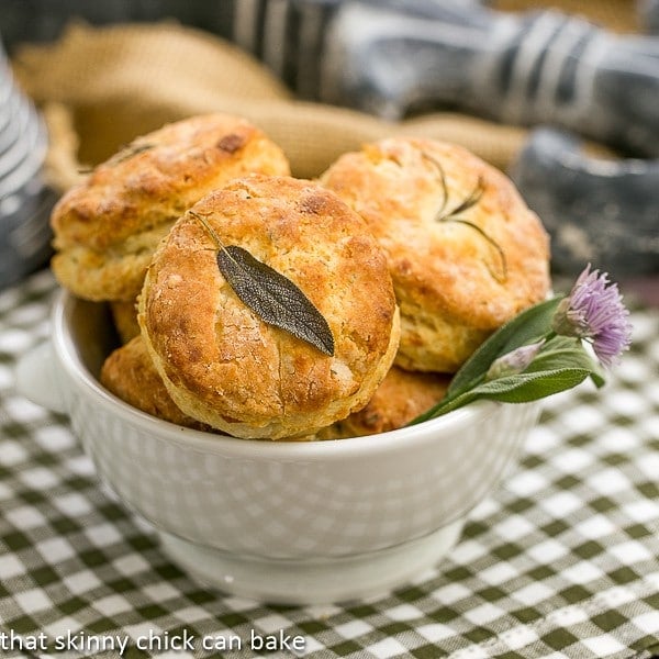 Herbed Buttermilk Biscuits in a bowl with a fresh herb garnish