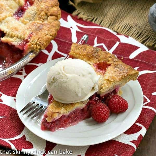 Lattice Topped Raspberry Pie slice with ice cream.