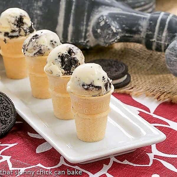 4 mini cones of Oreo Ice Cream on a white tray.