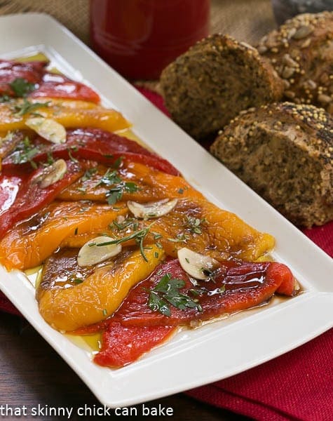 Close view of a variety of Oven Roasted Peppers on a white tray.