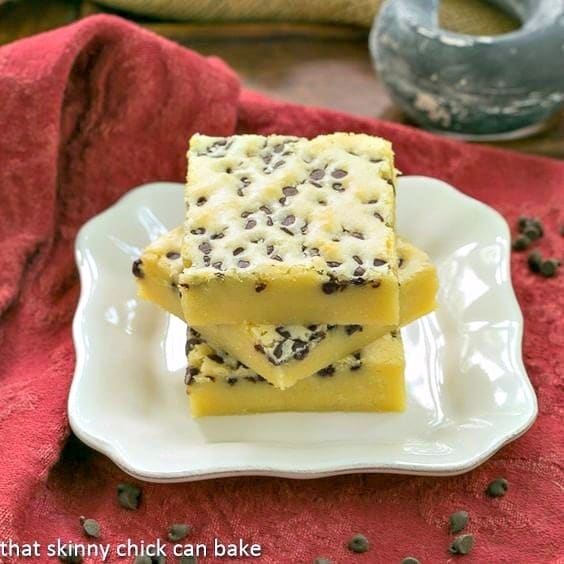 White Chocolate Brownies stacked on a white plate