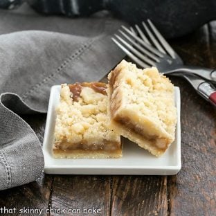 Two caramel bars on a small white plate