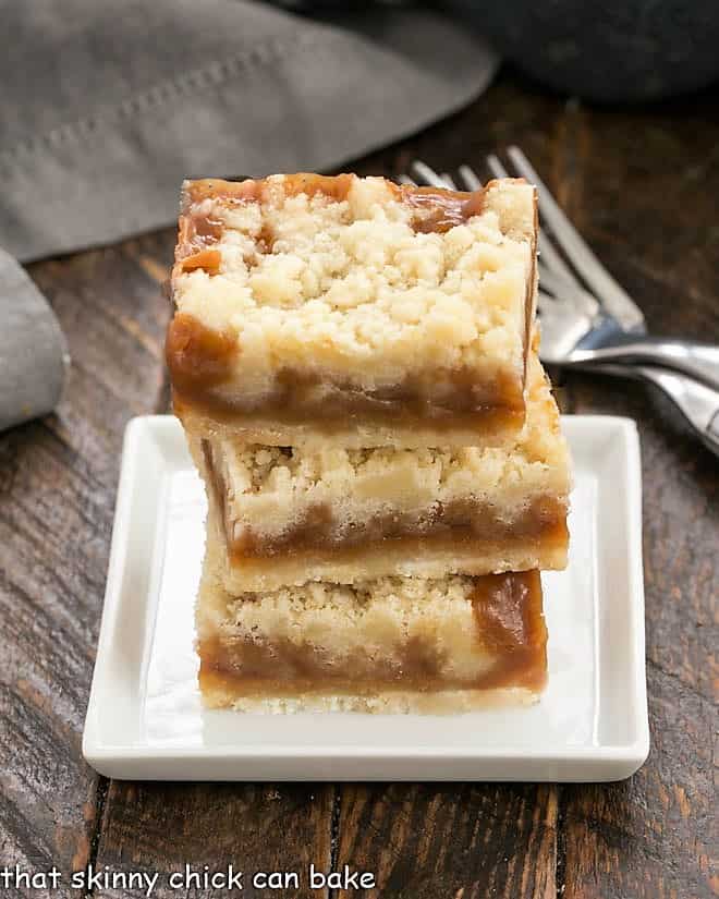 3 Oatmeal Carmelitas stacked on a small white plate.