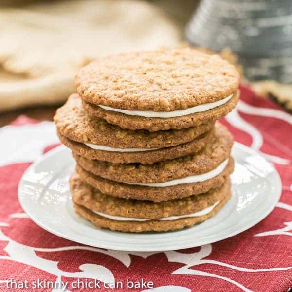 Oatmeal Creme Pies stacked on a white saucer.