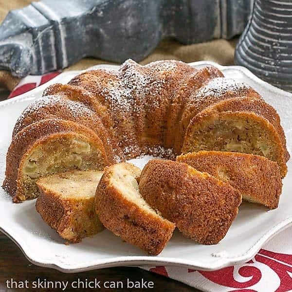 Apple Ginger Coffee Cake sliced on a ceramic platter