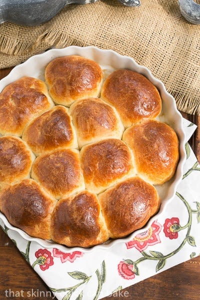 Brioche Dinner Rolls in a white ceramic baking dish.