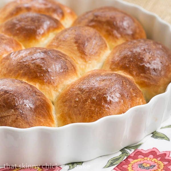 Brioche Dinner Rolls in a white ceramic dish.