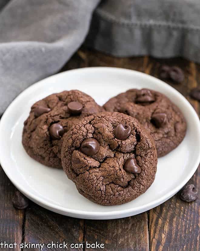 3 Double Chocolate Chunk Cookies on a white plate 