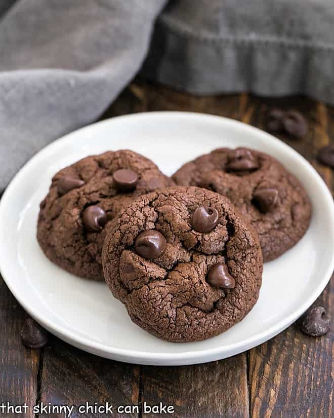 3 Double Chocolate Chunk Cookies on a white plate