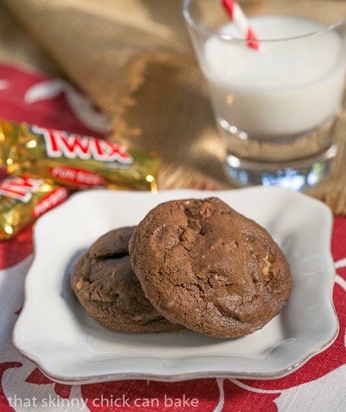 Two Double Chocolate Twix Cookies - on a white plate with a glass of milk