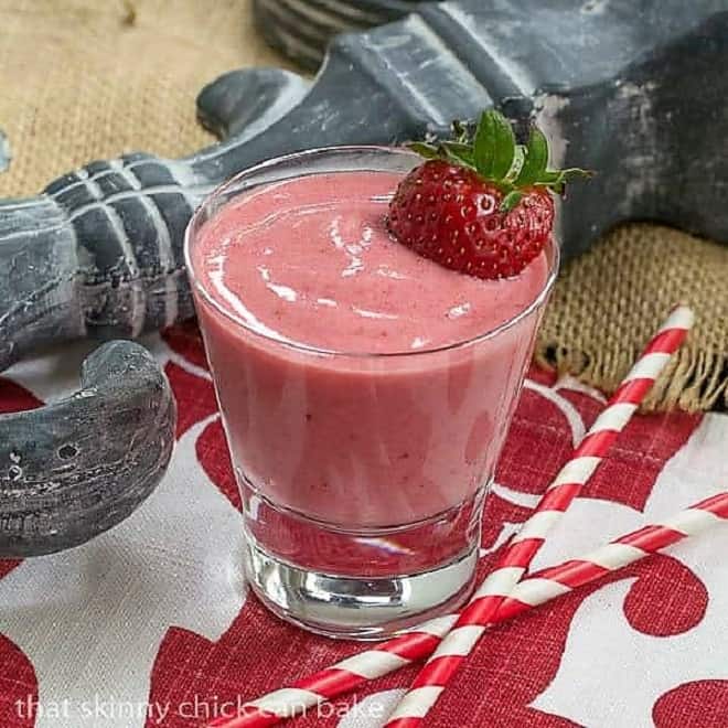 Berry Smoothie topped with a ripe strawberry