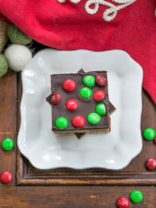 Overhead view of Candy Topped Toffee Squares on a small white plate.