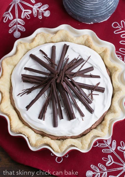 Overhead view of Black Bottom Chocolate Mousse Pie on a red and white cloth.