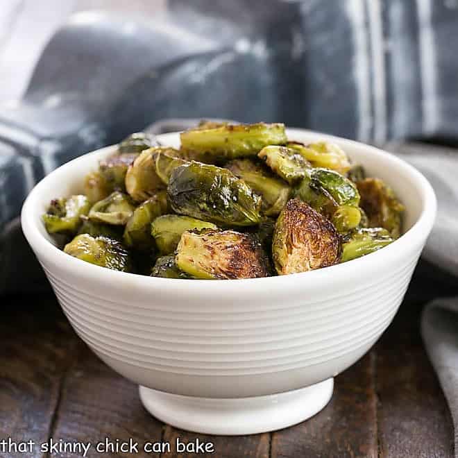 Roasted Brussels sprouts in a white ceramic bowl